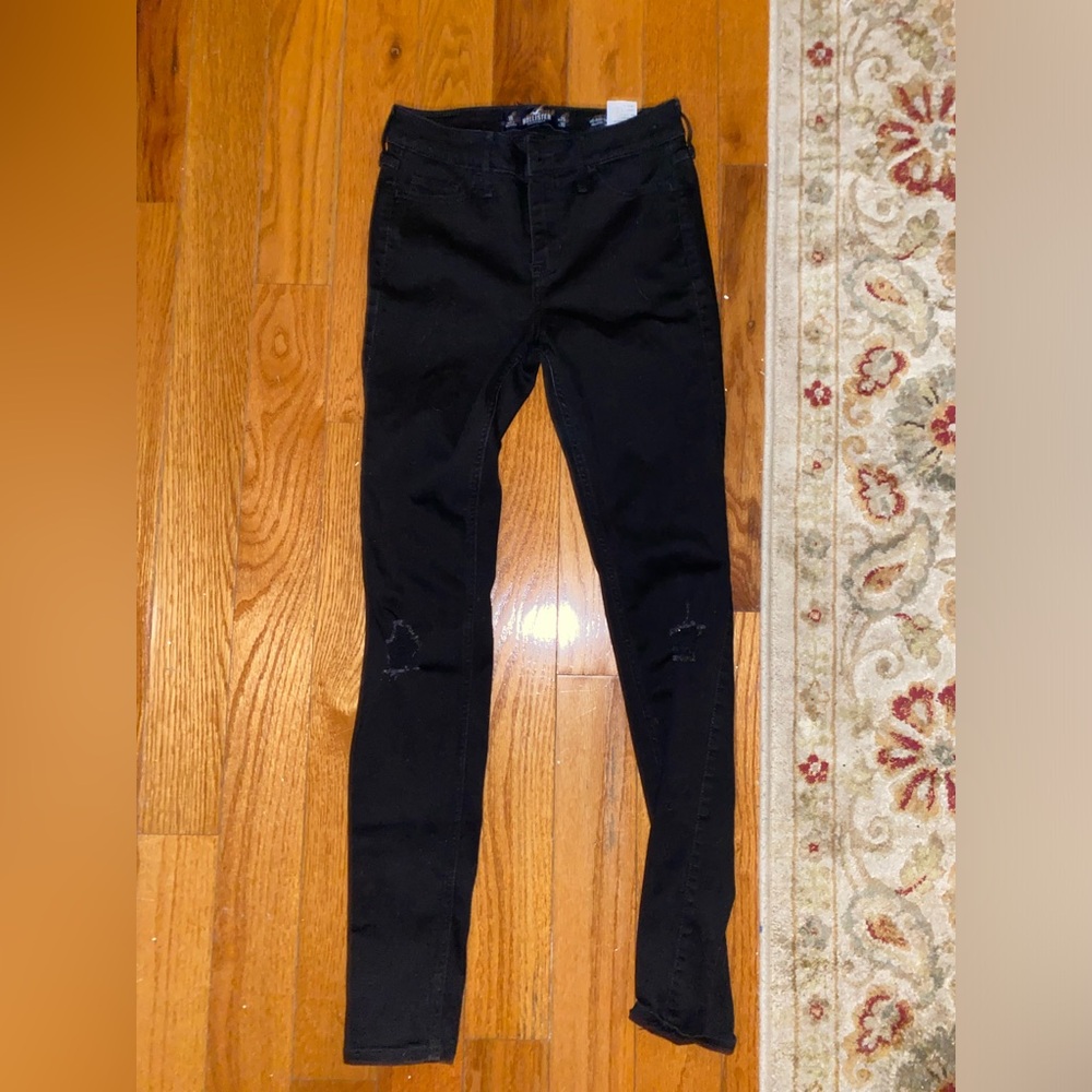 Black jeans with stylistic rips from Hollister